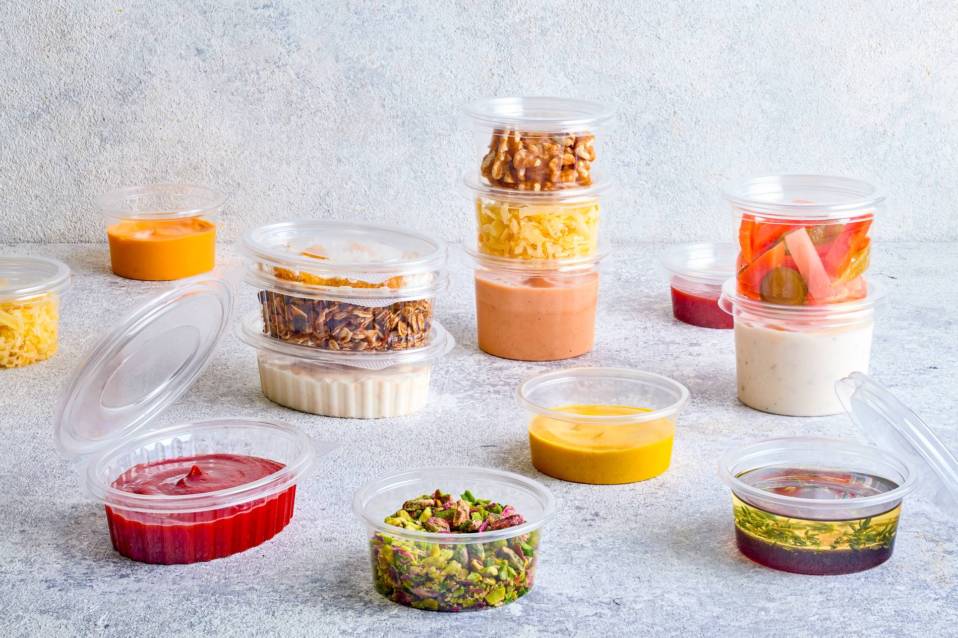 Sauce cups with sauces and desserts